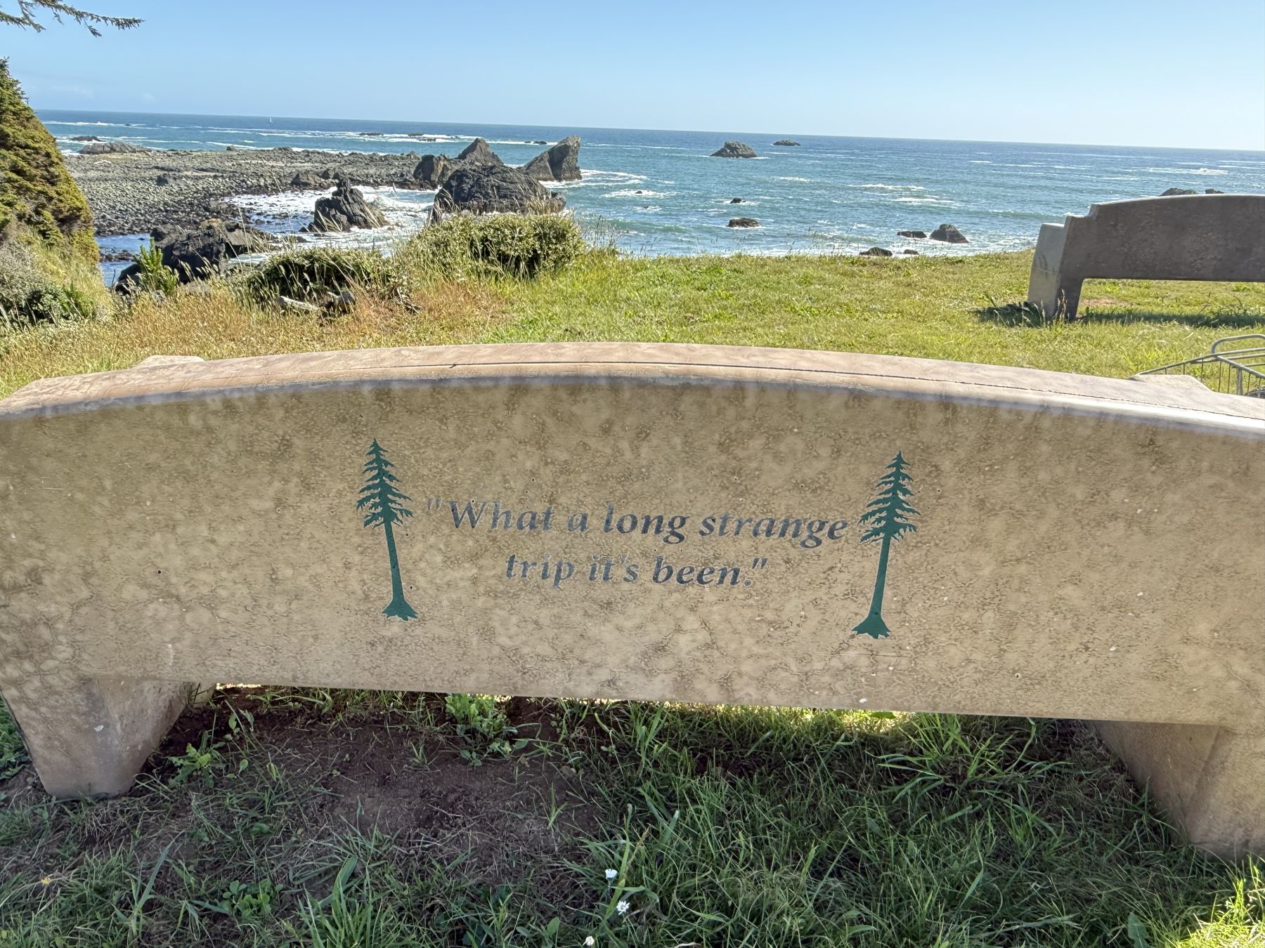 A bench above the rocks and sea stacks